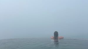 Morgan looking over the edge at Geosea Geothermal Sea Baths in Iceland