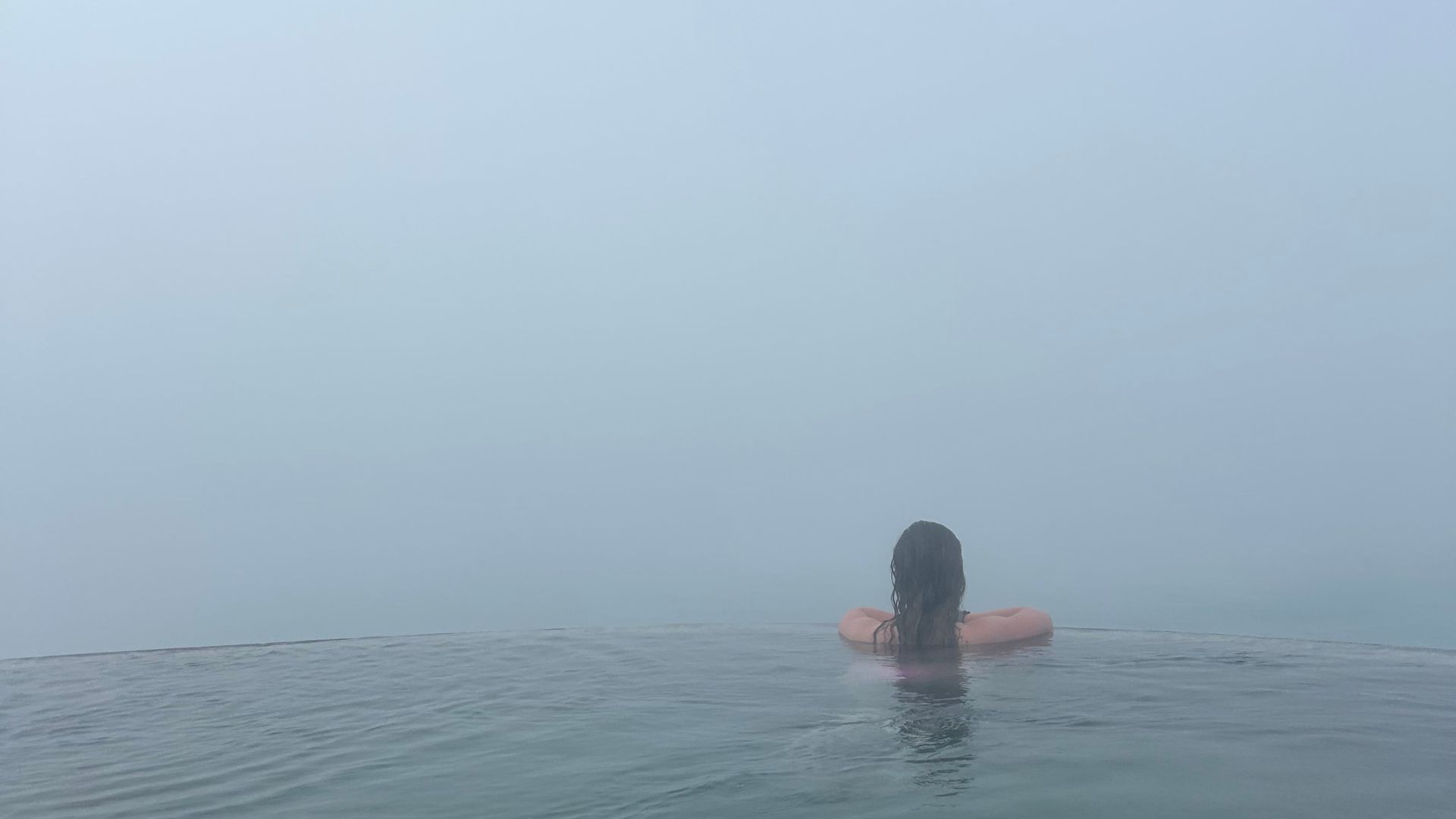 Morgan looking over the edge at Geosea Geothermal Sea Baths in Iceland