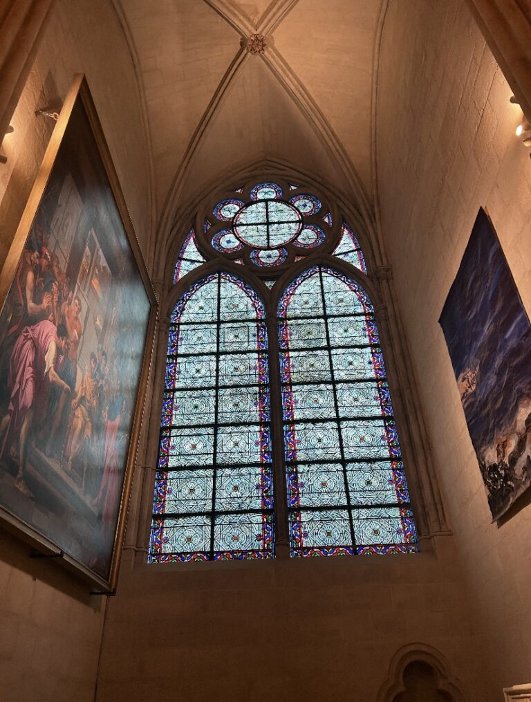 stained glass inside of the notre dame cathedral paris